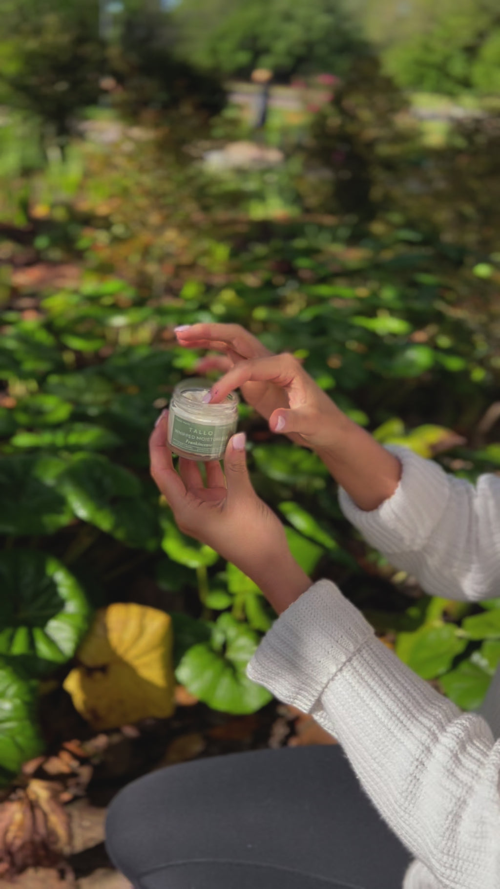 Video showing Tallo Whipped Moistuizer Unscented being applied to a female's hand. The texture is light and soft. This is a 2 oz jar of tallow based skincare.